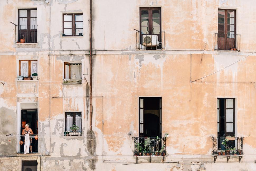 Free Image of Couple Standing in Window 