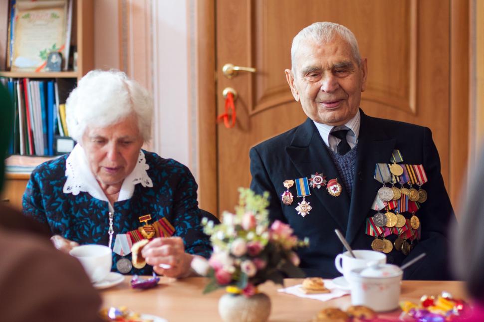 Free Image of Man and Woman Sitting at a Table 