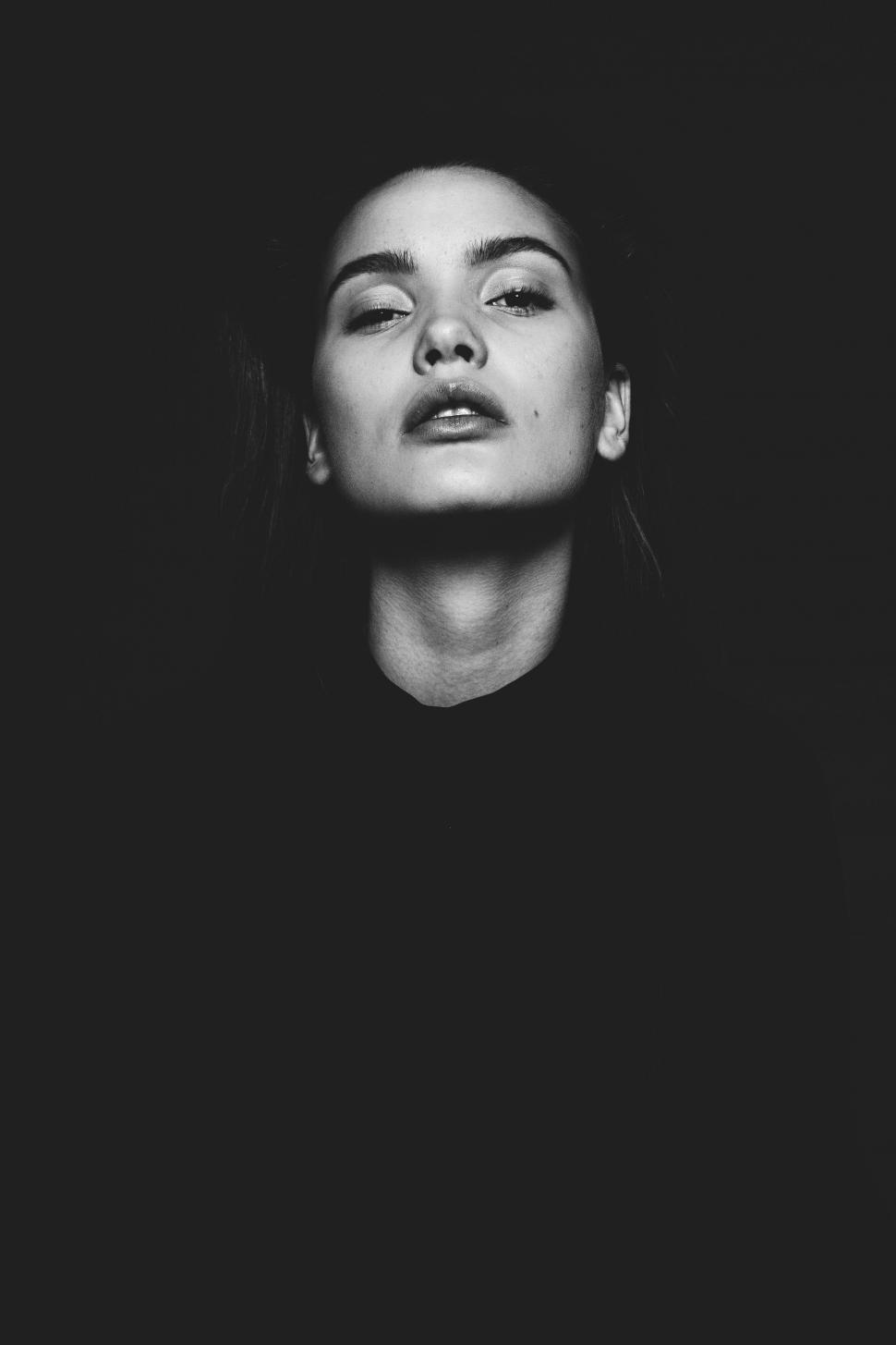 Free Image of Woman Closing Her Eyes in Black and White 