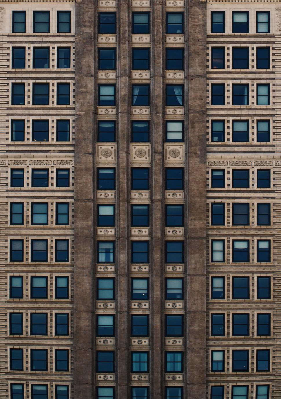 Free Image of Towering Building With Numerous Windows 