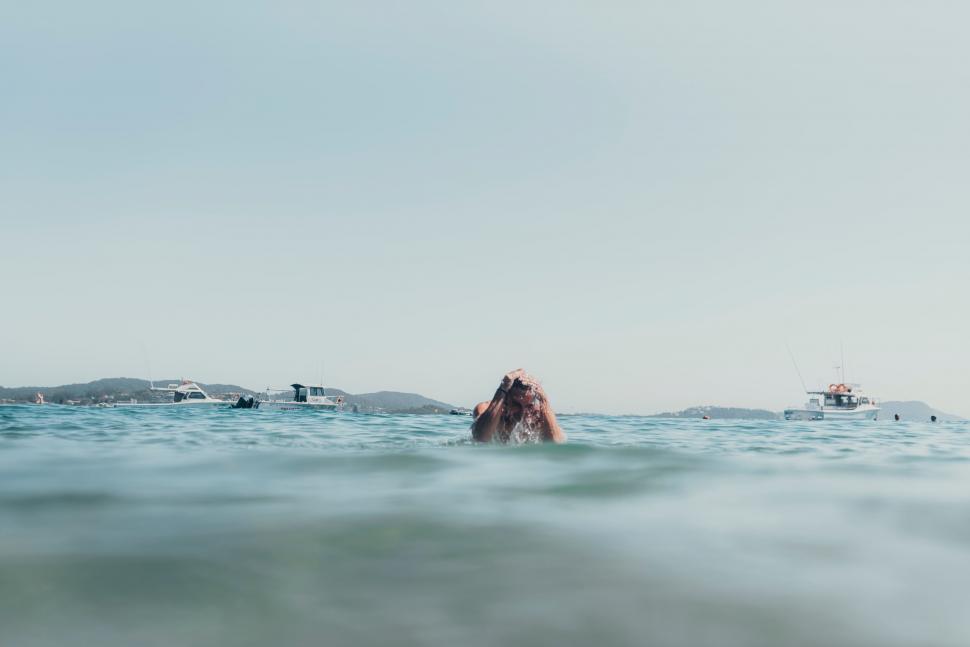Free Image of Group of People Swimming in the Ocean 