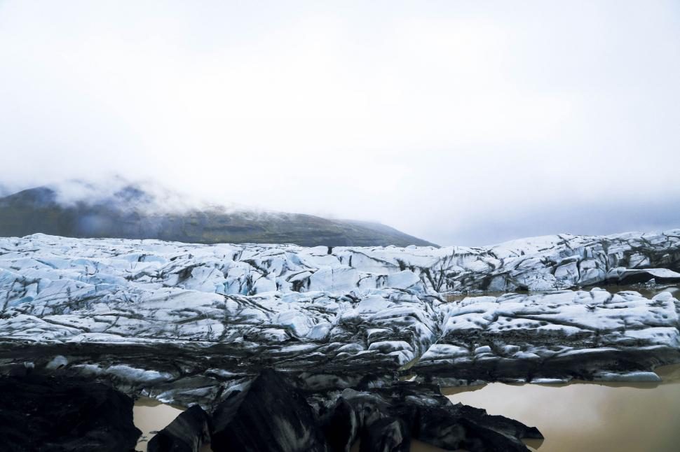 Free Image of Snow-covered Mountain and Body of Water 