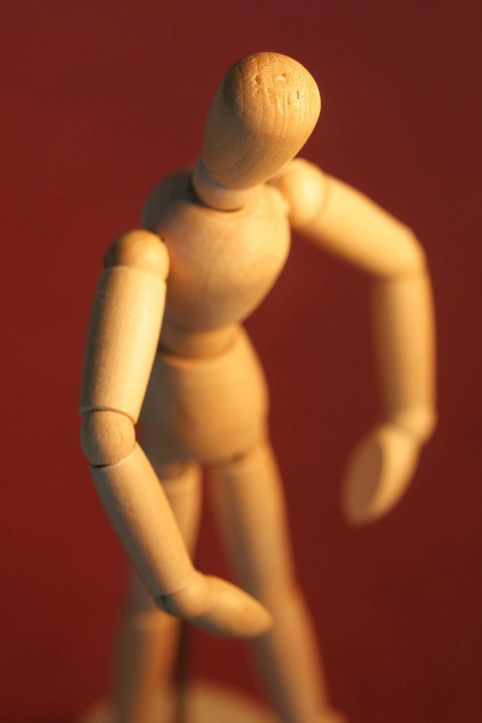 Free Image of Artists mannequin, red background 