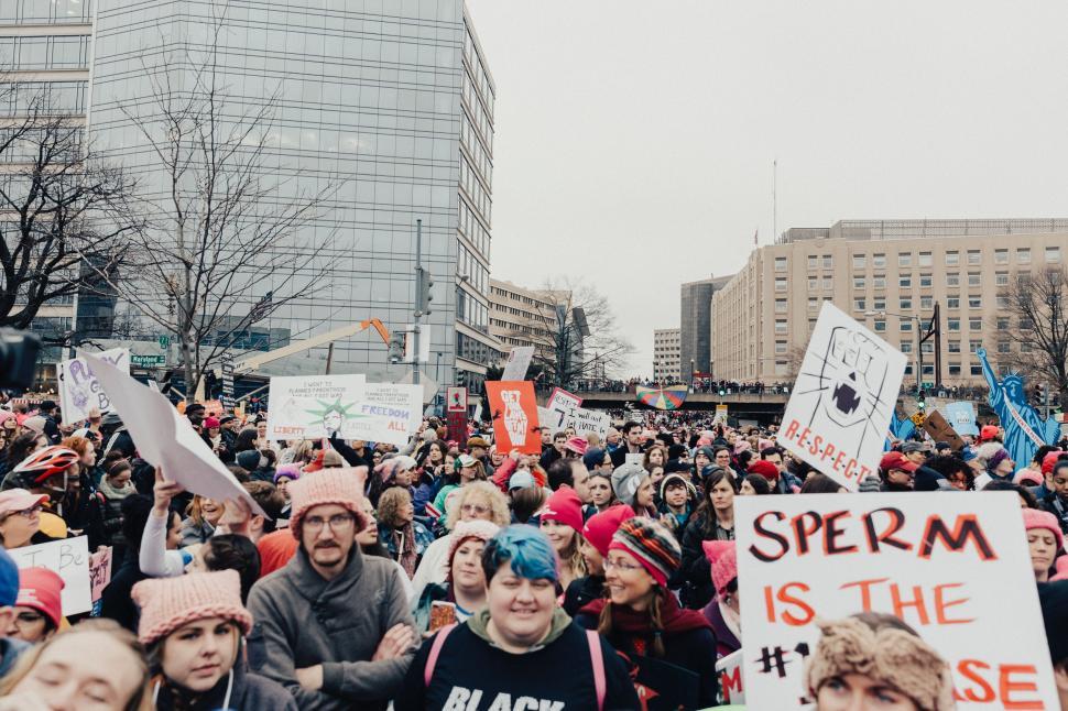 Free Image of Large Group of People Holding Up Signs 