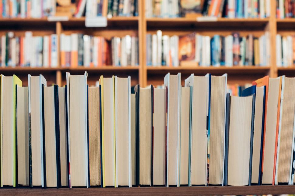 Free Image of Row of Books on Wooden Shelf in Library 
