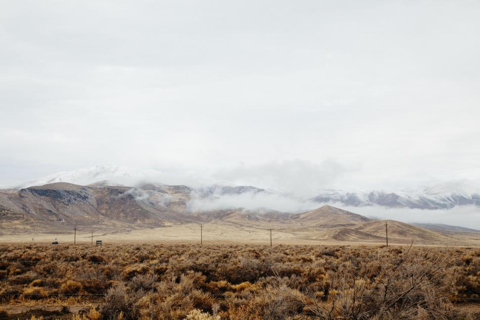 Free Image of Field With Mountains in the Background 