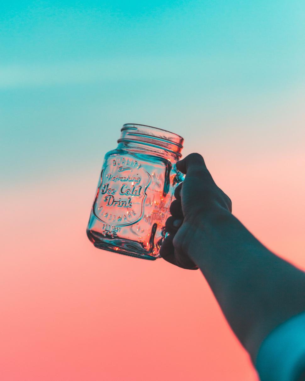 Free Image of Person Holding Mason Jar 