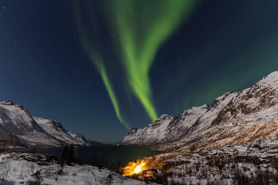 Free Image of Green Aurora Bore Above Snowy Mountain Range 