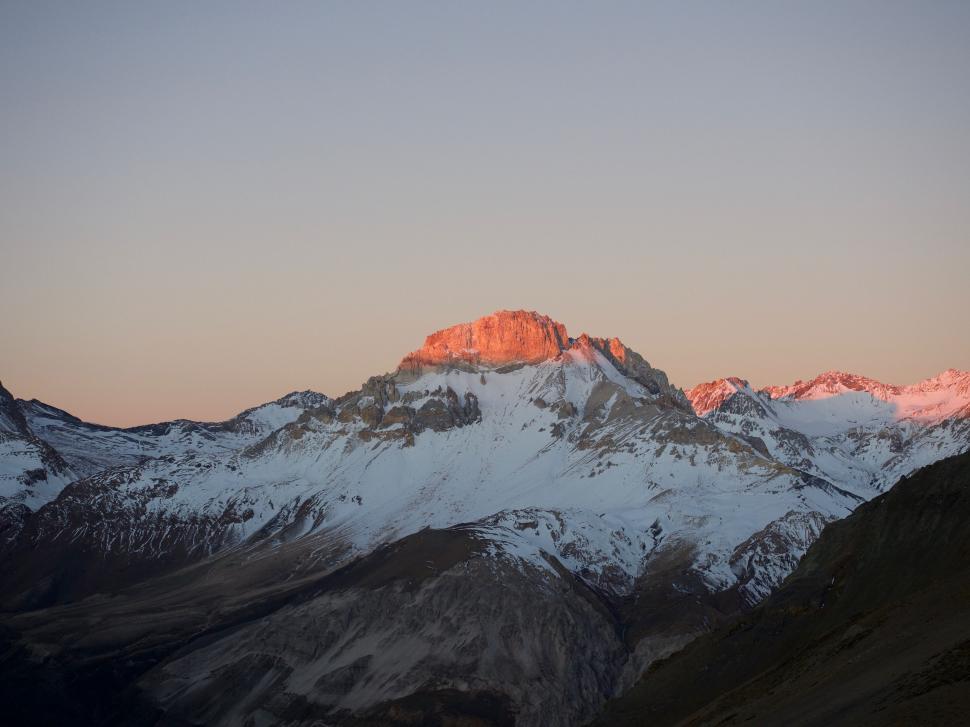 Free Image of Snow Covered Mountain With Pink Sky 