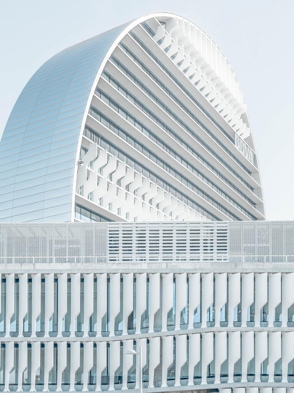 Free Image of Large White Building With Curved Roof 