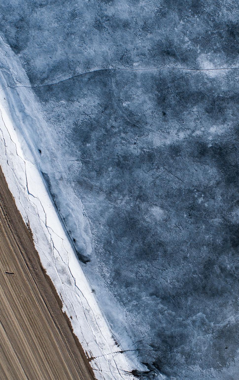 Free Image of Aerial View of Snow Covered Field 