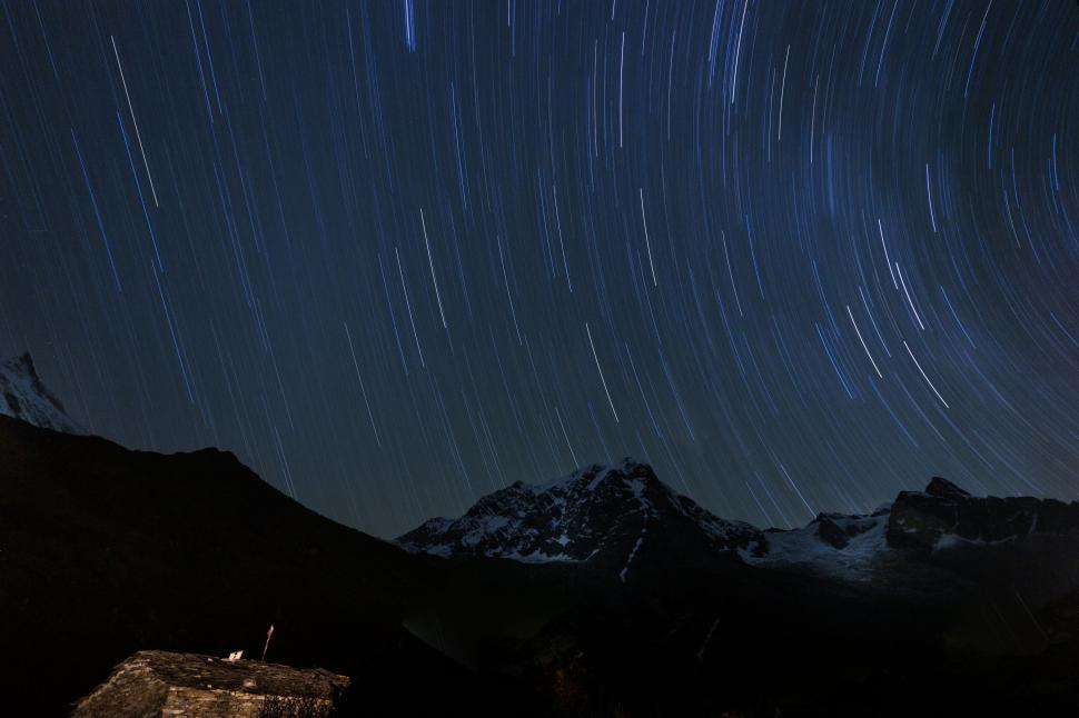 Free Image of Starry Night Sky Above Mountain Range 