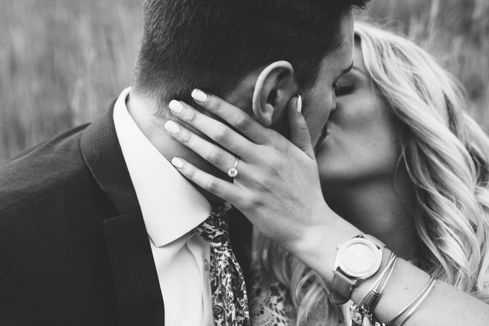 Free Image of Man and Woman Kissing in Field 