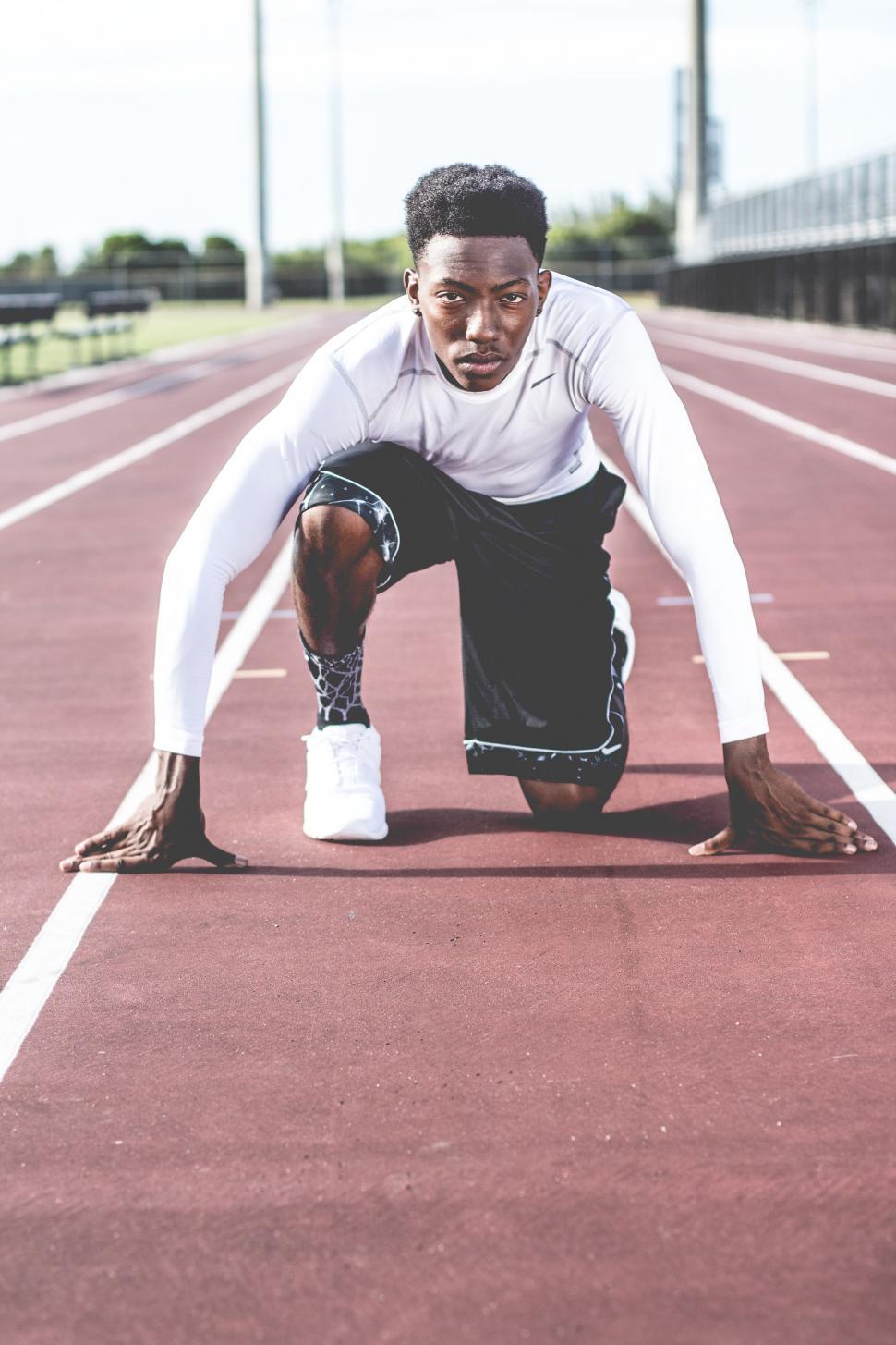 Free Image of Man Doing Push Ups on Track 