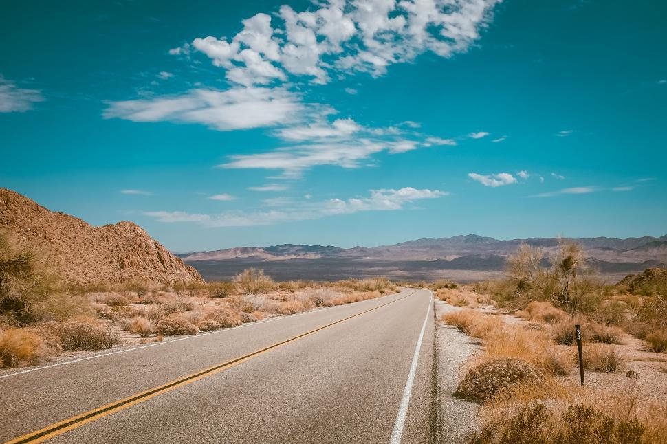 Free Image of Empty Road Cutting Through Desert Landscape 