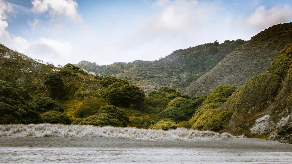 Free Image of Majestic Lake Surrounded by Towering Mountains 