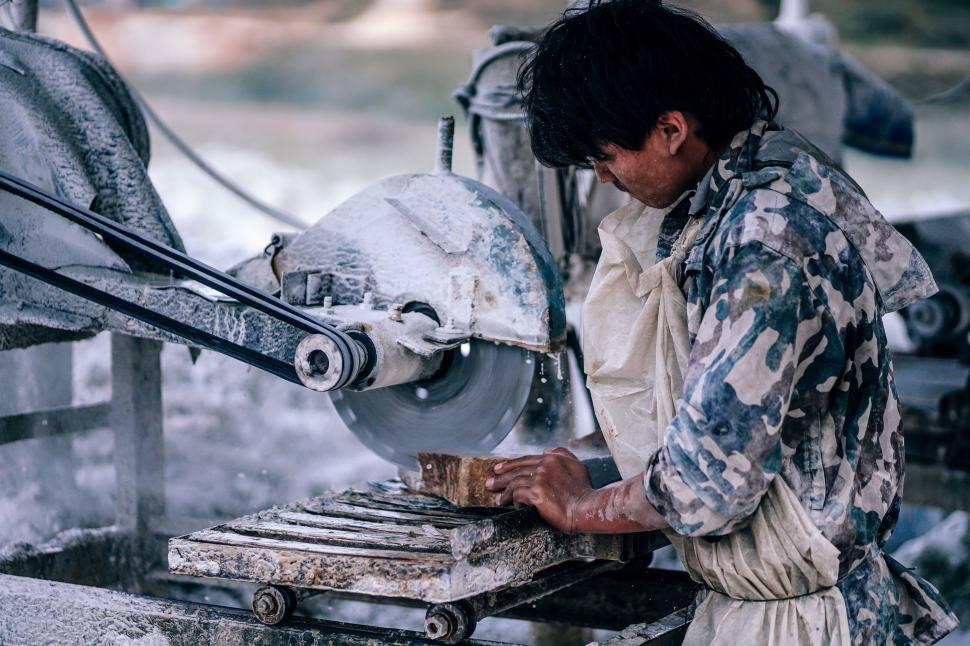 Free Image of Man Operating Machine in Factory 
