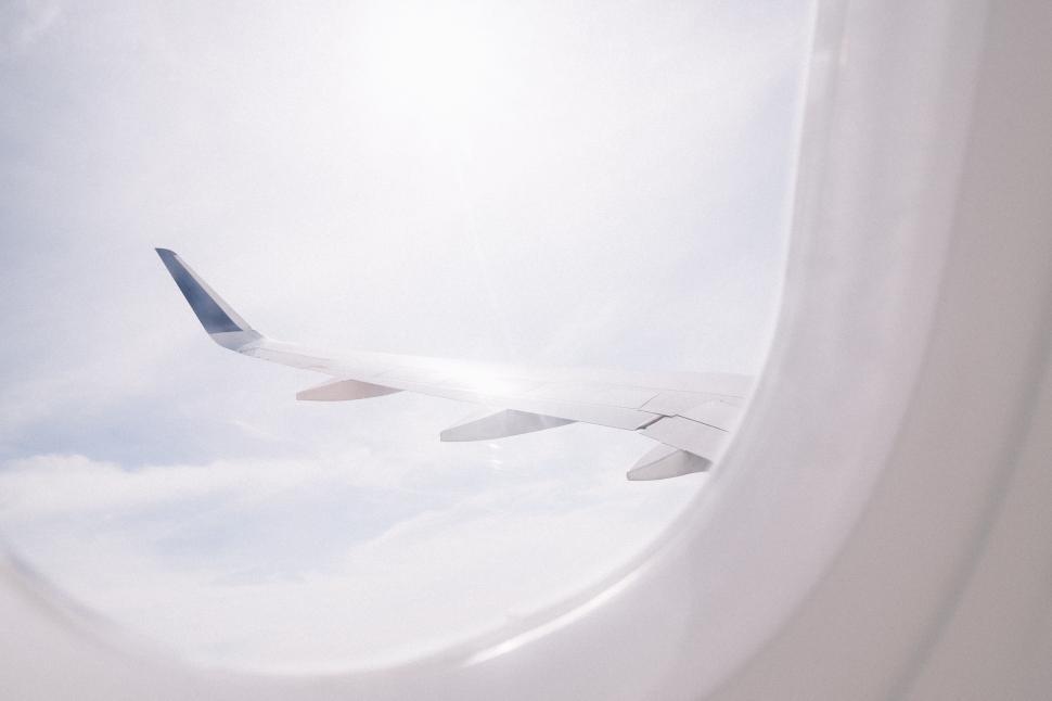 Free Image of Airplane Flying Through Clouds 