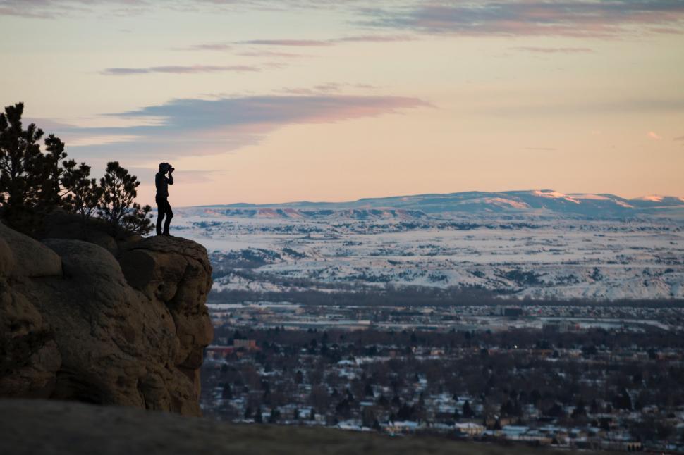 Free Image of Person Standing on Top of Cliff 