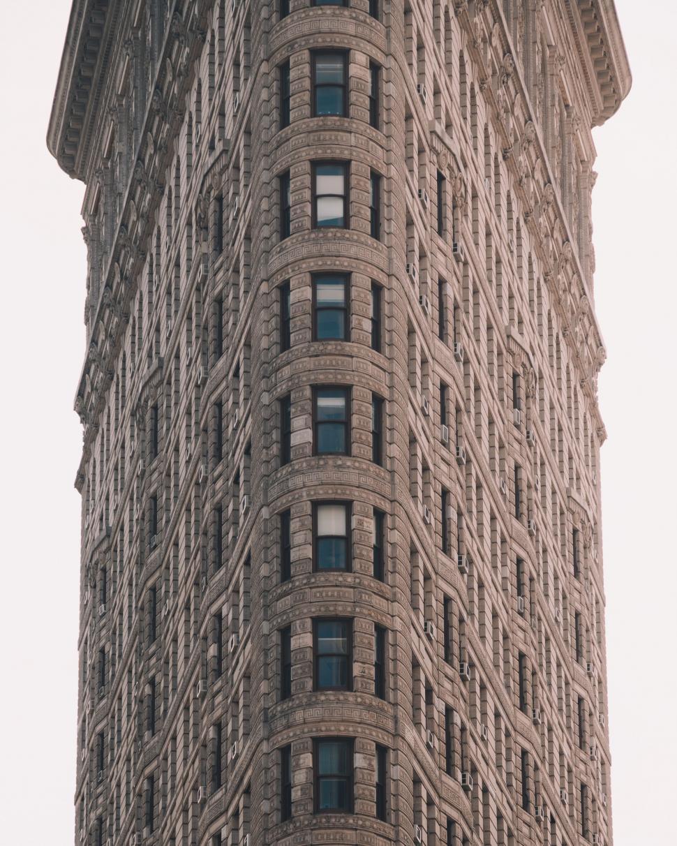 Free Image of Tall Building With Clock on Side 