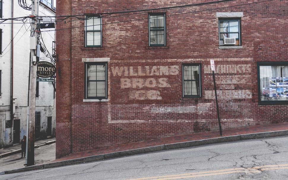Free Image of Brick Building With Sign 