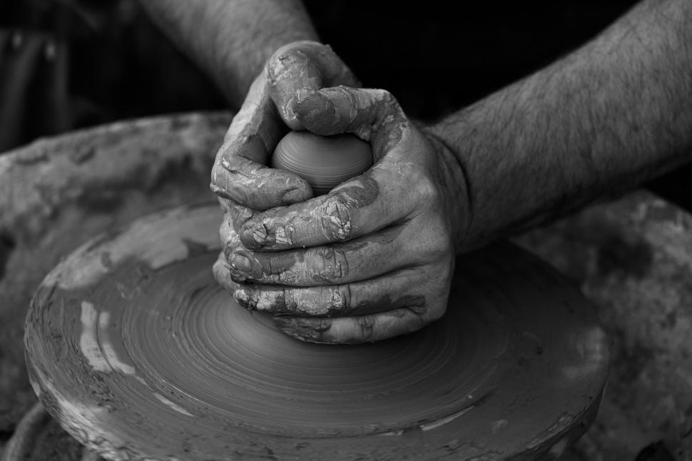Free Image of Man Creating Pot on Potters Wheel 