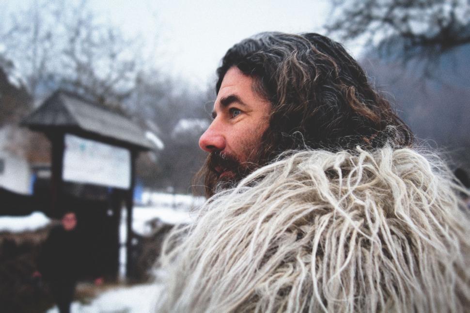 Free Image of Man With Long Hair Wearing Furry Coat 