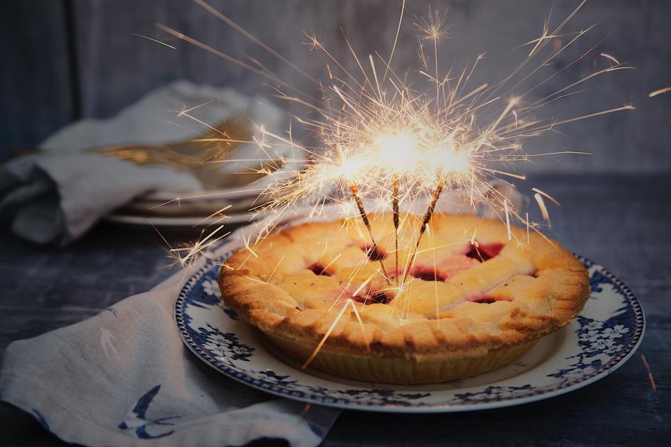 Free Image of Cake With Sparkler on Top 