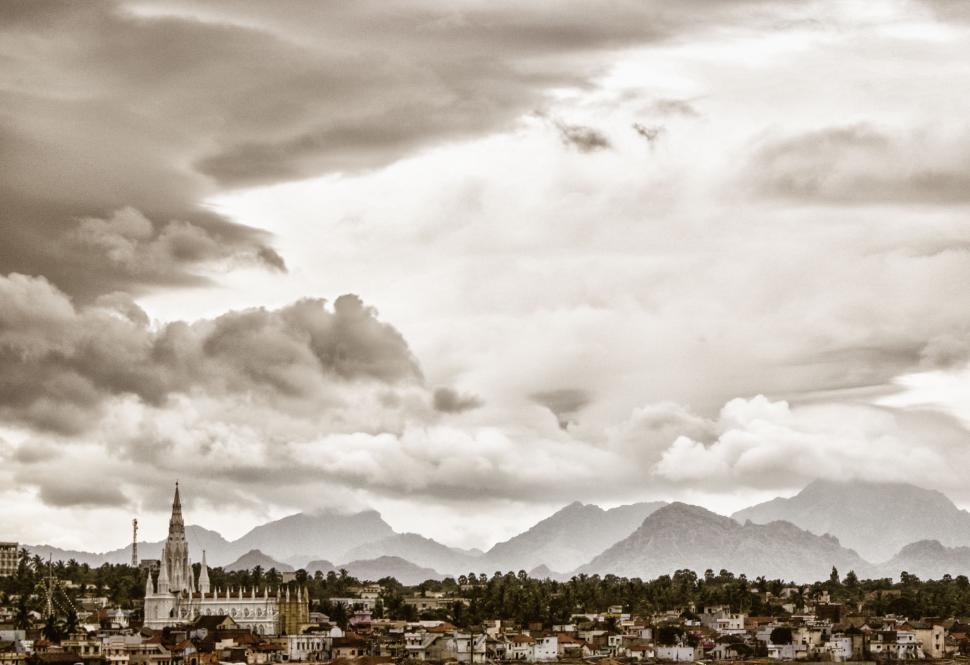 Free Image of Cityscape With Mountains in the Background 
