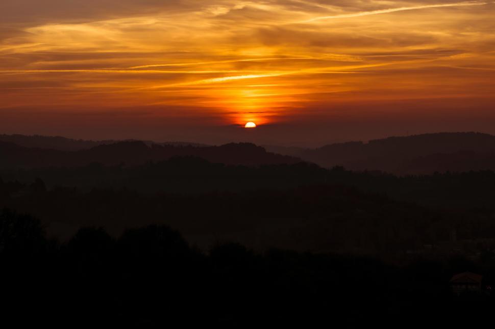 Free Image of Sun Setting Over Mountain Range 