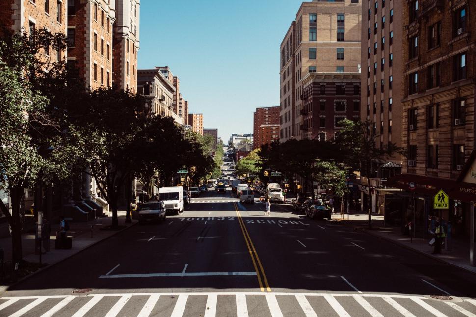 Free Image of Urban City Street With Buildings and Crosswalk 