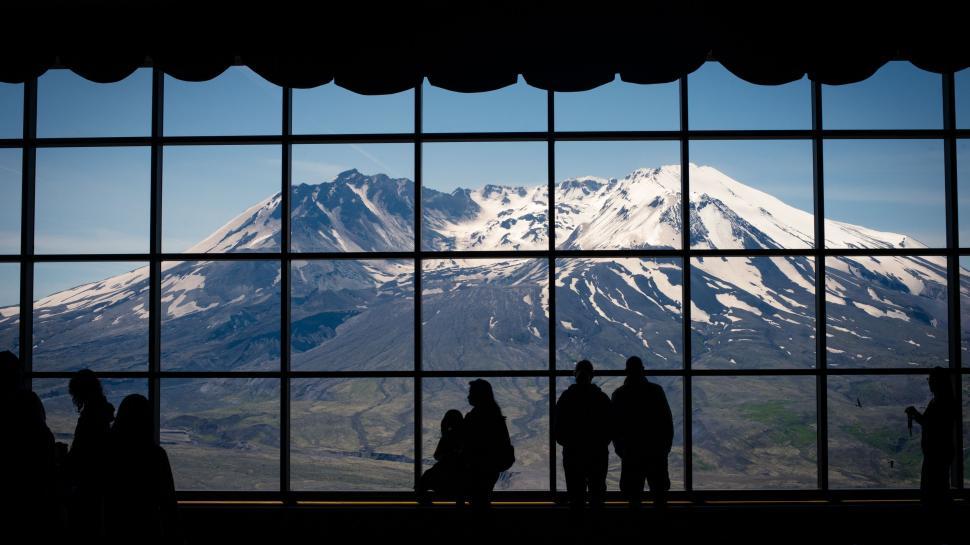 Free Image of Group of People Standing in Front of Window 