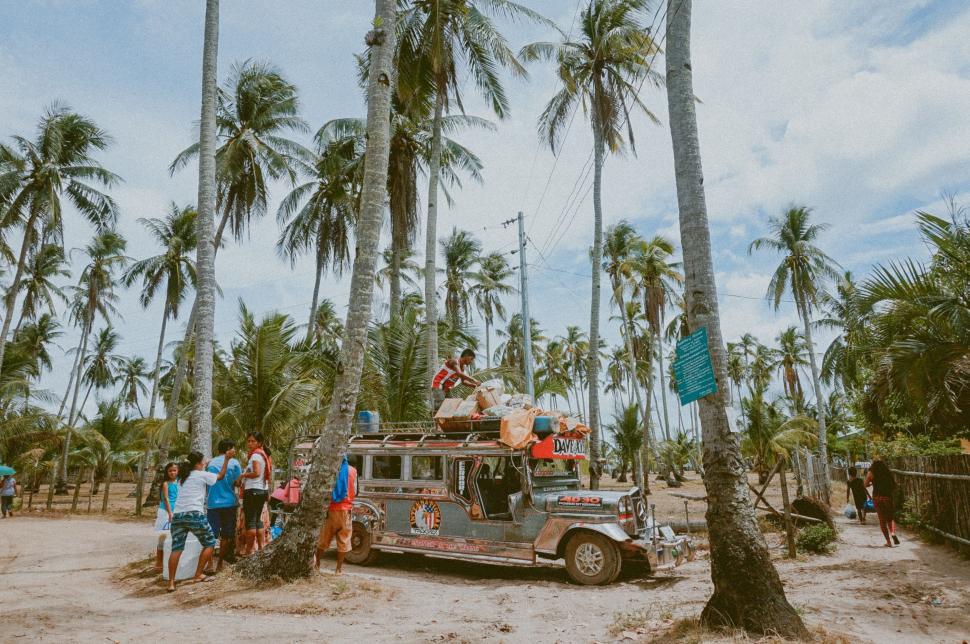 Free Image of Group of People Standing in Front of Truck 