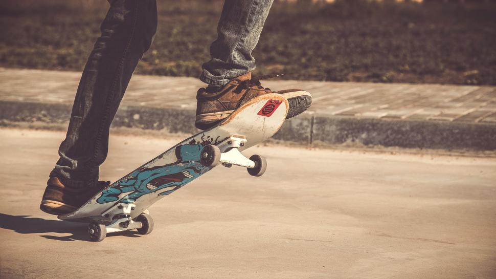 Free Image of Person Riding Skateboard on Street 
