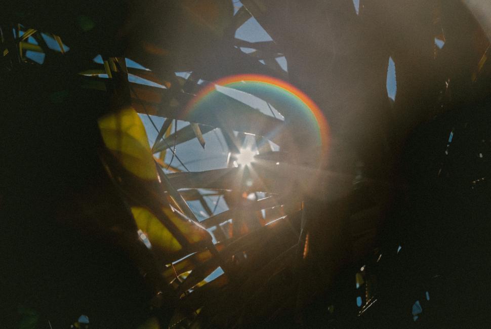 Free Image of Sun Shining Through Metal Structure 