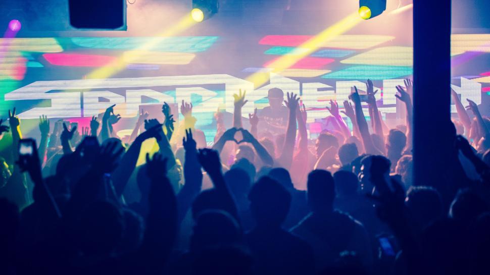 Free Image of Crowd of People at Concert With Hands Raised 
