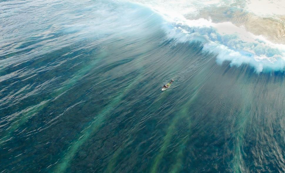 Free Image of Surfer Riding Large Wave in the Ocean 