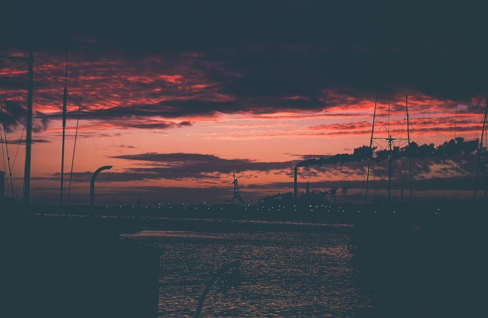 Free Image of Ocean and Industrial factory smoke from smokestacks 