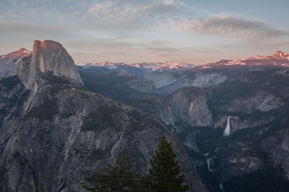 Free Image of Majestic Mountain Range With Distant Waterfall 