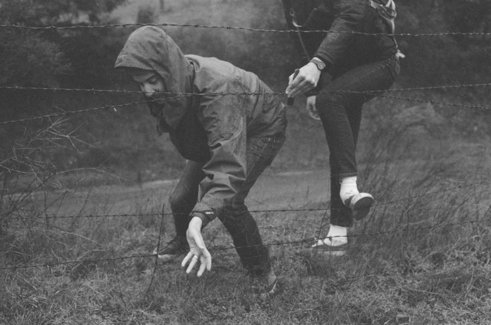 Free Image of Couple Standing in Grass 