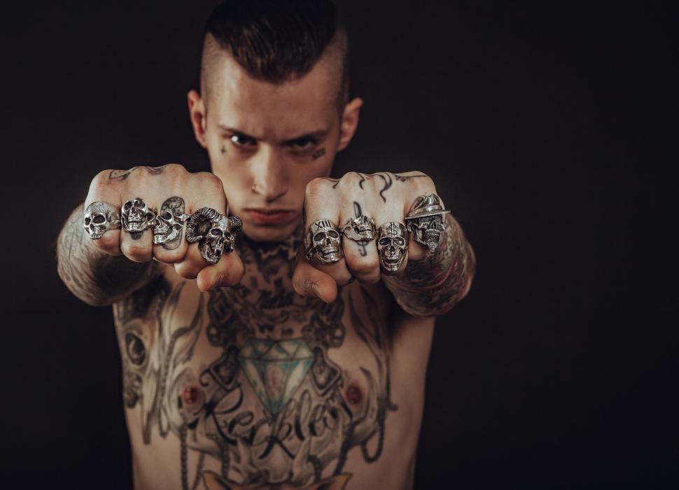 Free Image of Tattooed Man With Chest and Arm Tattoos 
