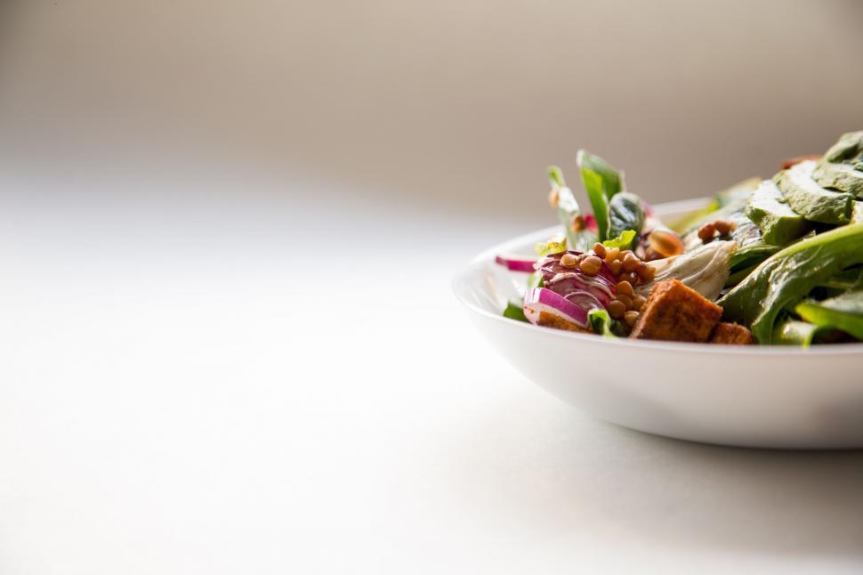 Free Image of White Bowl Filled With Salad on Table 