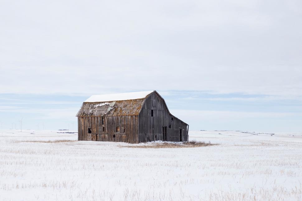 Free Image of Barn Standing in Snowy Field 