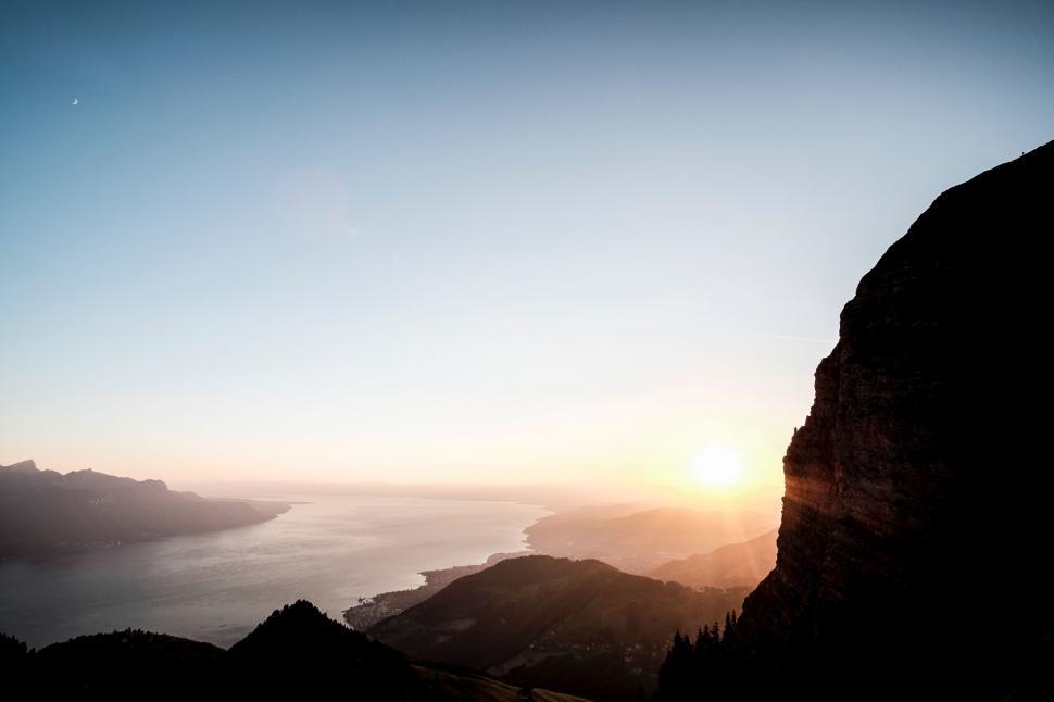 Free Image of Sun Setting Over Mountain Range 