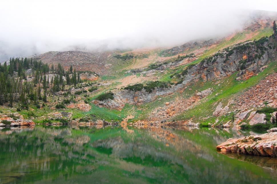 Free Image of Pristine Lake Surrounded by Mountains and Trees 