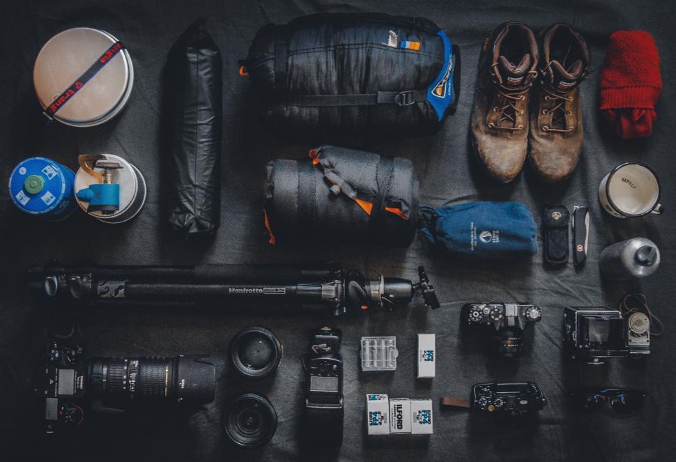 Free Image of Black Table Covered With Various Items 