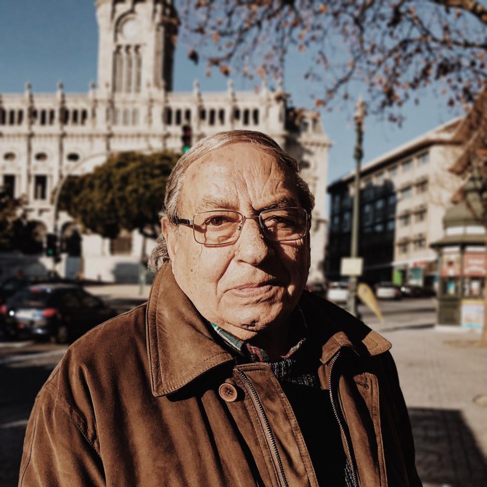 Free Image of Elderly Man Standing Alongside Street 