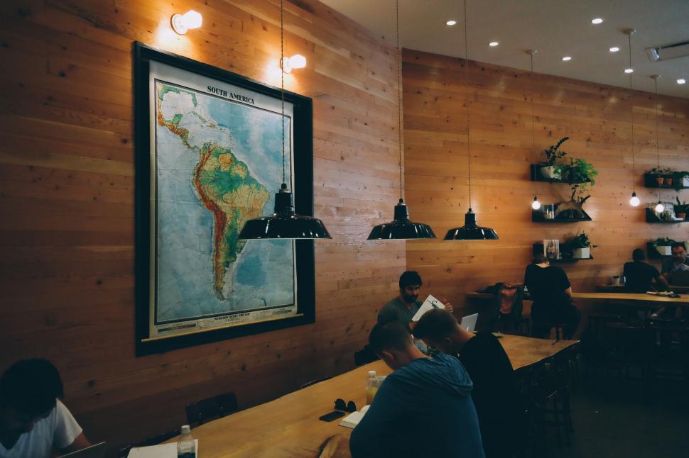Free Image of Group of People Sitting at Table in Restaurant 