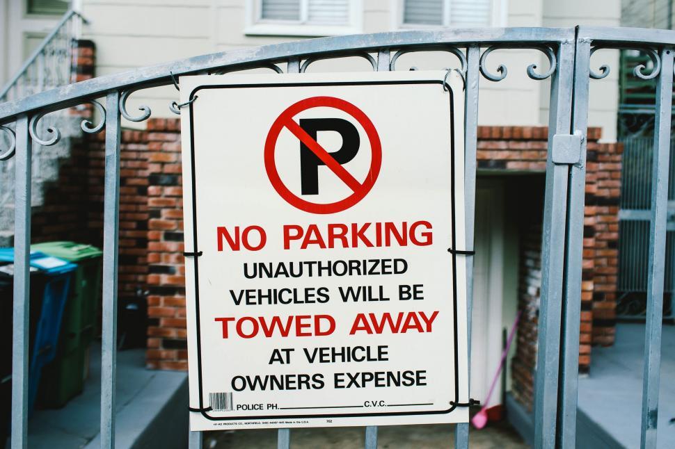 Free Image of No Parking Sign on Gate 