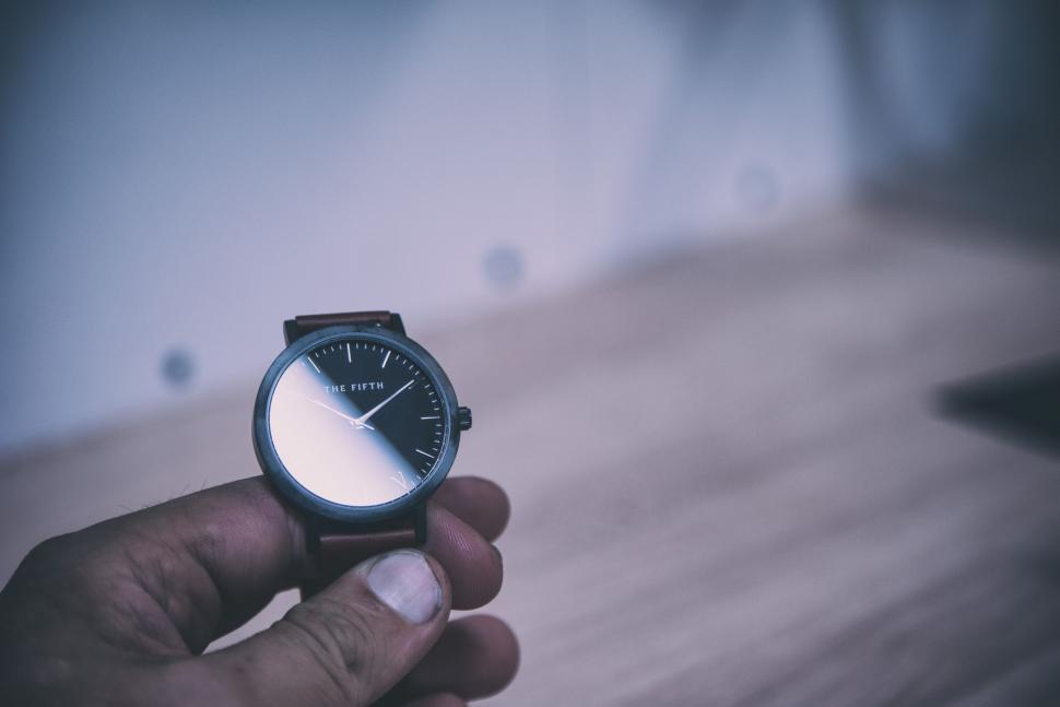 Free Image of Person Holding a Watch 